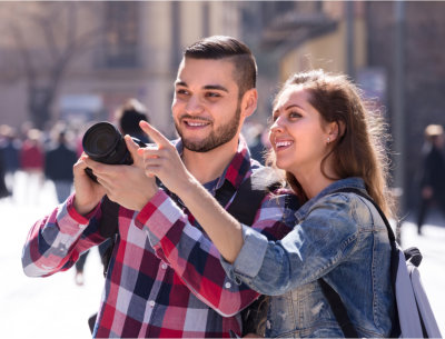 Couple holding a camera